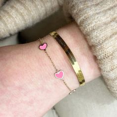 Calling all heart-lovers! The trendiest way to wear your heart on your sleeve. Available in a variety of colors!14K Yellow Gold5 Bubblegum Pink HeartsChain Length: 7 inchesEach heart measures: 7 millimetersThis piece is identical on both sides Lobster Clasp // Trendy Rose Gold Heart Bracelet For Valentine's Day, Heart Print Jewelry For Valentine's Day, Heart Charm Bangle Bracelet For Valentine's Day, Trendy Rose Gold Heart Bracelet, Valentine's Day Bangle Bracelet With Heart Charm, Valentine's Day Heart Charm Bangle Bracelet, Valentine's Day Rose Gold Heart Bangle Bracelet, Trendy Heart Charm Bracelet For Valentine's Day, Valentine's Day Heart Bracelet For Friendship