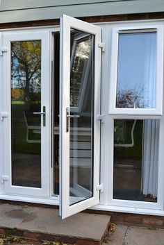 an open patio door on the side of a house