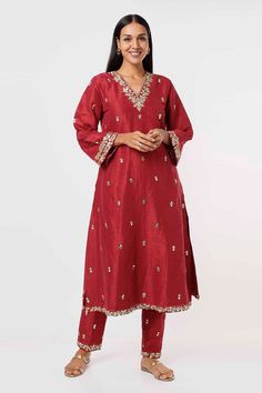 Raspberry red raw silk kurta with floral embroidery detailing. Comes with pant.
Components: 2
Pattern: Embroidery
Type Of Work: Floral
Neckline: V-neck
Sleeve Type: Flared
Fabric: Raw Silk
Color: Red
Other Details: 
Gold embroidery detailing
Occasion: Mehendi and Haldi - Aza Fashions Festive Anarkali Silk Pant Set, Festive Silk Anarkali Pant Set, Red Tissue Silk Kurta With Dabka Work, Red Traditional Tissue Silk Kurta, Traditional Red Tissue Silk Kurta, Red Embroidered Tussar Silk Set, Festive Silk Pant Set With Dabka Work, Festive Silk Pant Set With Resham Embroidery, Traditional Silk Pants For Festive Occasions