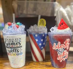 three different types of drinks on a wooden table with an american flag design and the words, it's all fun times