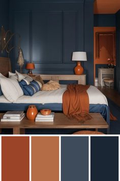 a bedroom with blue walls and orange accents