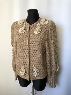 Size EUR 44. Would fit slightly better for sizes 40 or 42 as oversize All measurements are in centimiters Length 59 Chest 53 Waist 52 Bottom 54 Shoulders 40 Sleeve 68 Beige Cardigan With Floral Embroidery For Fall, Beige Floral Embroidered Cardigan For Fall, Fall Embroidered Beige Cardigan, Beige Embroidered Cardigan For Spring, Spring Beige Embroidered Cardigan, Elegant Puff Sleeve Cardigan For Spring, Vintage Embroidered Cardigan For Fall, Vintage Brown Cardigan For Spring, Vintage Cream Sweater For Spring