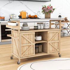 the kitchen island is made out of wood and has an open shelf on wheels for storage