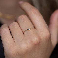 A simple solitaire ring with a natural blue sapphire gemstone in 14K gold. A minimalist ring for women, stackable and delicate that adds glam to every outfit. Sapphire is the birthstone of September. The best gift for girlfriend. 100% handcrafted with love! D E T A I L S ● Metal: 14K gold, 14K white gold ● Gemstone: Sapphire ● Sapphire's weight: 0.02ct ● Sapphire's diameter: 1.5mm H O W ∙ T O ∙ O R D E R Choose from the drop down menus the available options (Ring size, Metal) and leave us a note Blue Solitaire Birthstone Ring In 14k Gold, Dainty Solitaire Sapphire Ring With Round Band, Dainty Sapphire Solitaire Ring, Dainty Blue Sapphire Solitaire Ring, Dainty Sapphire Ring For Anniversary, Simple Yellow Gold Birthstone Ring, Minimalist Blue Sapphire Ring For Anniversary, Minimalist Blue Sapphire Solitaire Ring, Minimalist Blue Sapphire Promise Ring