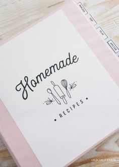 a recipe book sitting on top of a wooden table