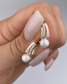 Silver earrings with gold inserts, adorned with pearls and zirconia stones, offer numerous advantages, making them an excellent choice for any jewelry enthusiast. 1. Aesthetic Appeal: The combination of silver and gold creates an exquisite contrast that highlights the beauty and elegance of the earrings. Pearls add classic sophistication, while zirconia stones provide a sparkle and brilliance similar to diamonds ✨. 2. Versatility: Thanks to the blend of precious metals and gemstones, these earri Silver Pearl Drop Clip-on Earrings For Evening, Luxury Pearl Drop Clip-on Earrings For Formal Occasions, Luxury Pearl Drop Clip-on Earrings For Parties, Elegant Sterling Silver Clip-on Pearl Earrings, Pearl-embellished Cubic Zirconia Drop Earrings, Drop Earrings Gold, 1 Aesthetic, Gold Drop Earrings, Bridal Wedding