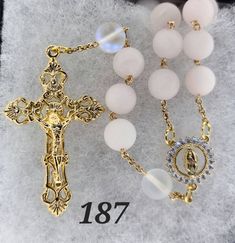 "10mm Rose Quartz Matte Finish Round Beads with 10mm Matte Finish Mermaid Beads, 2\" Gold Large Filigree Crucifix, ⅞\" Lady of Guadalupe Center with Rhinestones" Pink Rosary With 8mm Round Beads, Lady Of Guadalupe, Quartz Rose, Prayer Beads, Rosary, Round Beads, Bead Charms, Rose Quartz, Mermaid