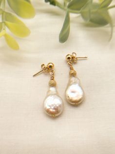 These are beautiful pearl earrings with 14K gold fill.  The bead is gold dust with lots of sparkle.  Great for everyday wear or for that special occasion. Pearl Drop Earrings With Gold Beads, Gold Pear-shaped Pearl Charm Earrings, Gold 14k Gold-filled Pearl Earrings For Anniversary, Gold 14k Gold Filled Pearl Earrings For Anniversary, Everyday Pear-shaped Gold Earrings, Gold Beaded Pearl Earrings, Pearl Earrings With Gold Beads For Gift, Gold Pearl Earrings With Gold Beads, Gold Pear-shaped Bridal Earrings With Pearl Charm