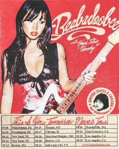 an advertisement for a rock band with a woman holding a guitar