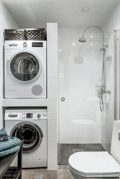 a washer and dryer in a small bathroom