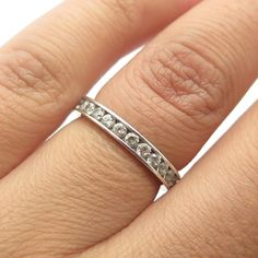 Great pre-owned condition.  925 Sterling Silver Round-Cut Shaped C Z All Around Eternity Ring Size 5  Weight: 2.2g   WELCOME TO PAWN SHOP We are an actual pawn shop and have been in business for over 25 years. Since 1990, our establishment has been serving a variety of clients by providing them with short term cash solutions and options of liquidity regarding their treasured heirlooms. Acknowledging that today′s customers are very sophisticated and are looking for a variety of investments, our a Classic Sterling Silver Eternity Band In Silver, White Gold Stackable Crystal Ring For Anniversary, Stackable White Gold Crystal Ring For Anniversary, Channel Set Stackable Round Rings, Classic Silver Crystal Ring With Channel Set, Silver Sterling Channel Set Eternity Band, Hallmarked White Gold Crystal Ring For Anniversary, Classic Silver Stackable Rings With Channel Set, Silver Hallmarked Stackable Rings For Anniversary