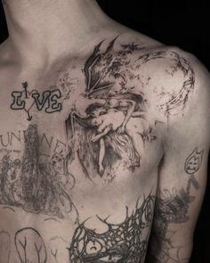 the back of a man with tattoos on his chest