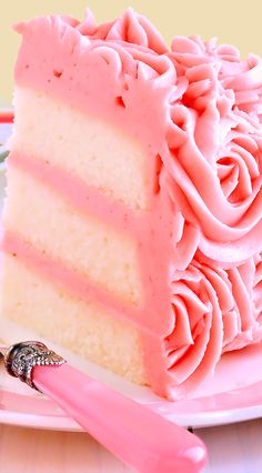 a piece of cake with pink frosting on it