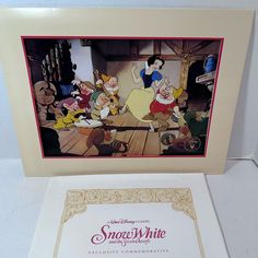 the snow white and the seven dwarfs signed by walt animation company is on display at disney's hollywood studios