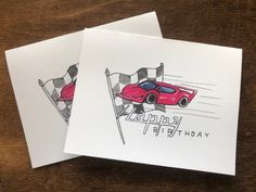 two greeting cards featuring a red sports car on a race track with the words happy birthday