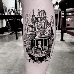 a black and white photo of a house on the leg