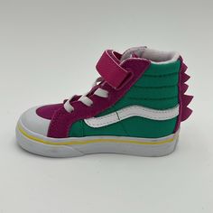 New Vans Kids Purple & Green Dino Sk8-Hi Reissue 138 V Little Kids Sneakers New With Tag / Without Box High-Top Paneled Suede And Canvas Sneakers In Purple And Green. Graphic Appliqus At Vamp And Heel. Round Rubber Cap Toe Elasticized Lace-Up And Velcro Closure Padded Tongue And Collar Treaded Rubber Outsole In Tan Supplier Color: Dino Fuchsia Red/Pepper Green Vans Us Size: Child's Foot Length 10.5: 6.125 / 15.6 Cm 11: 6.25 / 15.9 Cm 11.5: 6.375 / 16.2 Cm 12: 6.625 / 16.8 Cm 12.5: 6.75 / 17.1 Cm 13: 6.875 / 17.5 Cm 1: 7.25 / 18.4 Cm 1.5: 7.375 / 18.7 Cm 2: 7.5 / 19.1 Cm 2.5: 7.625 / 19.4 Cm 3: 7.875 / 20 Cm Upper: Leather, Textile. Sole: Rubber Purple Vans Slip-on Sneakers, Purple Low-top Vans Sneakers, Purple Slip-on Vans Sneakers, Sporty Purple Vans Sneakers, Purple Vans Sneakers With Rubber Sole, Purple Vans High-top Sneakers, Vans Sporty Non-slip Sneakers, Sporty Purple Vans Skate Shoes, Sporty Non-slip Vans Sneakers