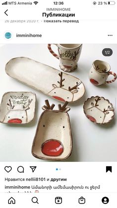 a group of dishes and cups with reindeer faces on them