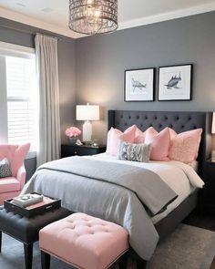 a bedroom with gray walls and pink accents