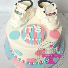 a cake with shoes on top of it