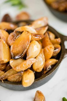 some nuts are sitting in a bowl on the counter top, ready to be eaten