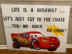 a sign that says, life is a highway let's just cut to the chase you - me - hoo ka - chow