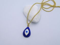 Fantastic Evil Eye Necklace, Greek Pendant, Blue Evil Eye Jewelry, Lucky Eye Gift, Greece Charm, Golden Greek Jewelry,Birthday Gift,Perfect Greek Gift It is a Unique and absolutely hand carved Bronze and Gold plated pendant necklace , inspired from Ancient Greek art. It is made by high quality of Bronze metal. Hand carved Greek Evil Eye . Each piece made by hand, with mini tools and hand tools ,as people has used in Ancient Greece. It is 100% Handmade. Feel proud to wear a real Greek hand carved Long necklace. -Antique Bronze -Gold plated -White Enamel -Dark Blue Enamel -Width: 12 mm / 0.47 inches -Height: 18 mm / 0.70 inches -Greek evil eye -Hand Carved -Handmade -Hand Engraved -Steel gold plated ball chain 1.5mm You can also enjoy all my Gold plated collection, here: https://www.etsy.com Spiritual Blue Jewelry For Birthday, Spiritual Blue Jewelry For Birthdays, Blue Spiritual Necklaces For Party, Handmade Blue Necklaces For Birthday, Handmade Blue Jewelry For Birthday Gift, Mini Tools, Evil Eye Hand, Greek Gifts, Ancient Greek Art