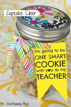 a cookie in a jar with a tag on it that says i'm going to be one smart cookie with you as my teacher