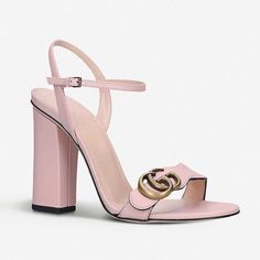 The Gucci GG Marmont Block Heel Sandal in Perfect Pink is crafted from a smooth calfskin leather in Italy. These high heeled sandals feature a curved, wavy toe strap with a Marmont GG logo, branded insole, adjustable ankle strap, an open toe, almond shaped toe, and 4" block heel. Perfect Pink Gucci GG Marmont Block Heel Sandal Antique gold-tone hardware High heel sandal shoes Curved toe strap GG logo plaque Adjustable ankle strap Open toe Almond shaped toe 4" block heel Size 39, 39.5 Product num Elegant Leather Heels With Adjustable Strap, Gold-tone Hardware Leather Heels, Leather Sandals With Gold-tone Hardware For Evening, Evening Leather Sandals With Gold-tone Hardware, Luxury Leather Sandals With Adjustable Strap, Elegant Calf Leather Sandals With Gold-tone Hardware, Luxury Pink Calf Leather Heels, Luxury Formal Sandals With Adjustable Strap, Leather Sandals With Adjustable Strap For Evening