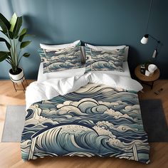 a bed with blue and white waves on it