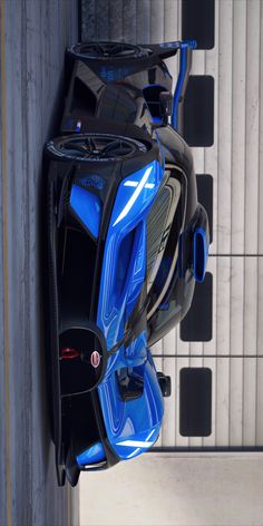 a blue sports car hanging from the side of a wall