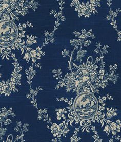 a blue and white wallpaper with floral designs