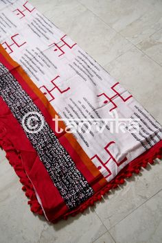 Presenting a range of light, breezy, and soft mul cotton Sarees which are perfect for the summers! This 'spiritual' themed hand block printed saree is made on pure mul cotton in white featuring texts and the spiritual symbols. The soul of this saree lies in its comfort and ease of carrying. You can style this with crop tops or blouses, a messy bun, junk jewelry and mojris or flats! The print might have slight irregularities in the pattern & colors which results from the human involvement in Bohemian Cotton Dupatta For Festive Occasions, Cotton Dupatta With Printed Border, Cotton Dupatta With Printed Border For Navratri, White Cotton Dupatta With Block Print, Handloom Cotton Dupatta For Festival, Summer Chanderi Dupatta With Block Print, Summer Chanderi Dupatta With Printed Border, Festive Cotton Dupatta With Block Print, Cotton Saree With Bandhani Print For Navratri