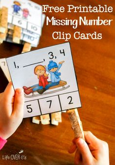 a hand holding up a missing number clip card with numbers on it and the words free printable missing number clip cards