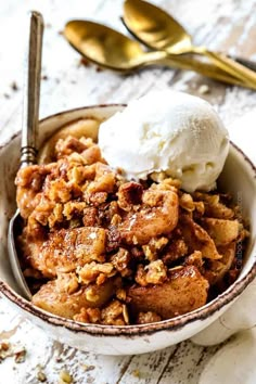 a bowl filled with food and ice cream on top of a table