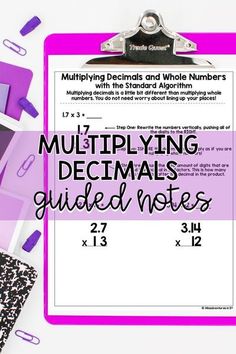 a clipboard with the text multiplying decmals guided notes on it