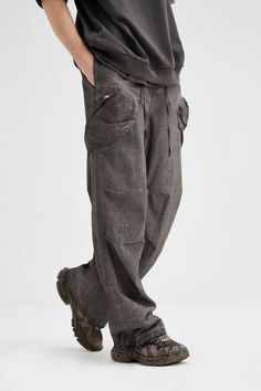 The Multi-Pocket Crinkled Drawstring Cargo Pants blend street style with a rugged, post-apocalyptic vibe. Featuring a dirty-fit, these pants have large pockets sewn onto both thighs for functionality and style. The crinkled design at the knees adds texture, while the adjustable waistband with a strap and drawstring ensures a customizable fit. Drawstrings at the cuffs allow for further adjustments, making these slightly oversized cargo pants both practical and bold. Crafted from premium 100% cott Grunge Baggy Cargo Pants With Side Pockets, Baggy Grunge Parachute Pants With Pockets, Rugged Streetwear Pants With Pockets, Rugged Straight Leg Pants For Streetwear, Grunge Pants With Pockets For Streetwear, Grunge Streetwear Pants With Pockets, Rugged Cargo Pants For Streetwear, Baggy Grunge Cargo Pants With Pockets, Baggy Cargo Style Grunge Pants