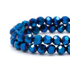 two rows of blue glass beads on a white background