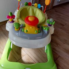 a baby's high chair that is on the floor