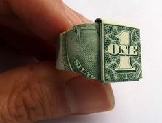 a dollar bill ring with the word one on it