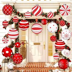 red and white christmas ornaments hanging from the front door