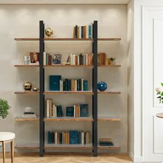 a book shelf with many books on it in a room next to a chair and table