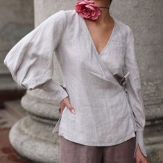 "The Bishop Sleeve Linen Blouse draws inspiration from our Victorian linen blouse. While this Linen Blouse maintains the beloved puffy sleeves, it has a less formal look with lightweight buttonless cuffs. The wrap design allows for easy on and off and also enables adjustments to the top's fit. We love wearing the Victorian top with cargo pants. DETAILS  ⚬ Wraparound design. ⚬ The V-neck is decorated with handmade stitches. ⚬ Puff long sleeves. ⚬  Exaggerated cuffs. ⚬ Ties at the side. ⚬  Side slits. ⚬ Made of washed organic Oeko-Tex certified linen. ⚬ The linen is NOT see-through. FIT / SIZE ⚬ Designed to be slightly fitted.  ⚬ Sizes XXS to 7XL (please see detailed size chart in photos). ⚬ Handmade to order (can be made-to-measure, please write down your measurements in the personalization Luxury Blouse, Blouse Drawing, Victorian Top, Blouse Puff Sleeve, Poet Blouse, Poet Shirt, Linen Wrap Dress, Black Linen Dress, White Linen Dresses