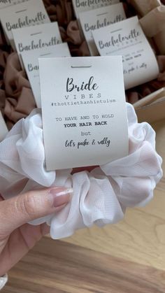 a person holding up a card with some sort of label on it that says bride