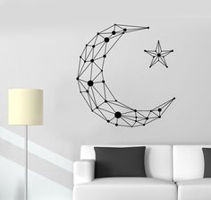 a white couch sitting next to a wall with a star and crescent design on it