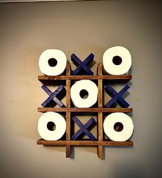 several rolls of toilet paper are stacked on top of each other in the shape of a tic - tac - toe