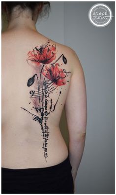 the back of a woman's body with flowers painted on her upper and lower part