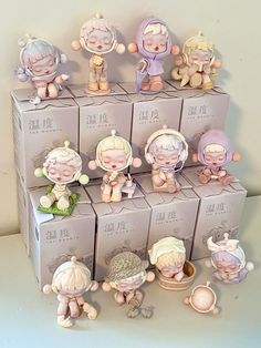 there are many small figurines in the box on this table, and one is for sale