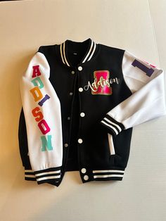 Varsity Jackets Unisex Fit Varsity Jacket Casual Lightweight College Style Long Sleeve Outerwear With Letter Patch, Hooded Varsity Jacket With Letter Embroidery For Fall, Varsity Long Sleeve Outerwear For Campus, Fall Hooded Varsity Jacket With Letter Embroidery, Hooded Outerwear With Letter Embroidery For Fall, Fall College Style Outerwear For School, Varsity Jacket With Letter Embroidery, Varsity Hooded Outerwear With Letter Embroidery, Fall School Varsity Jacket With Letter Print