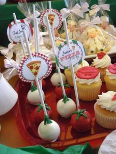 cupcakes and candy are on display at a party